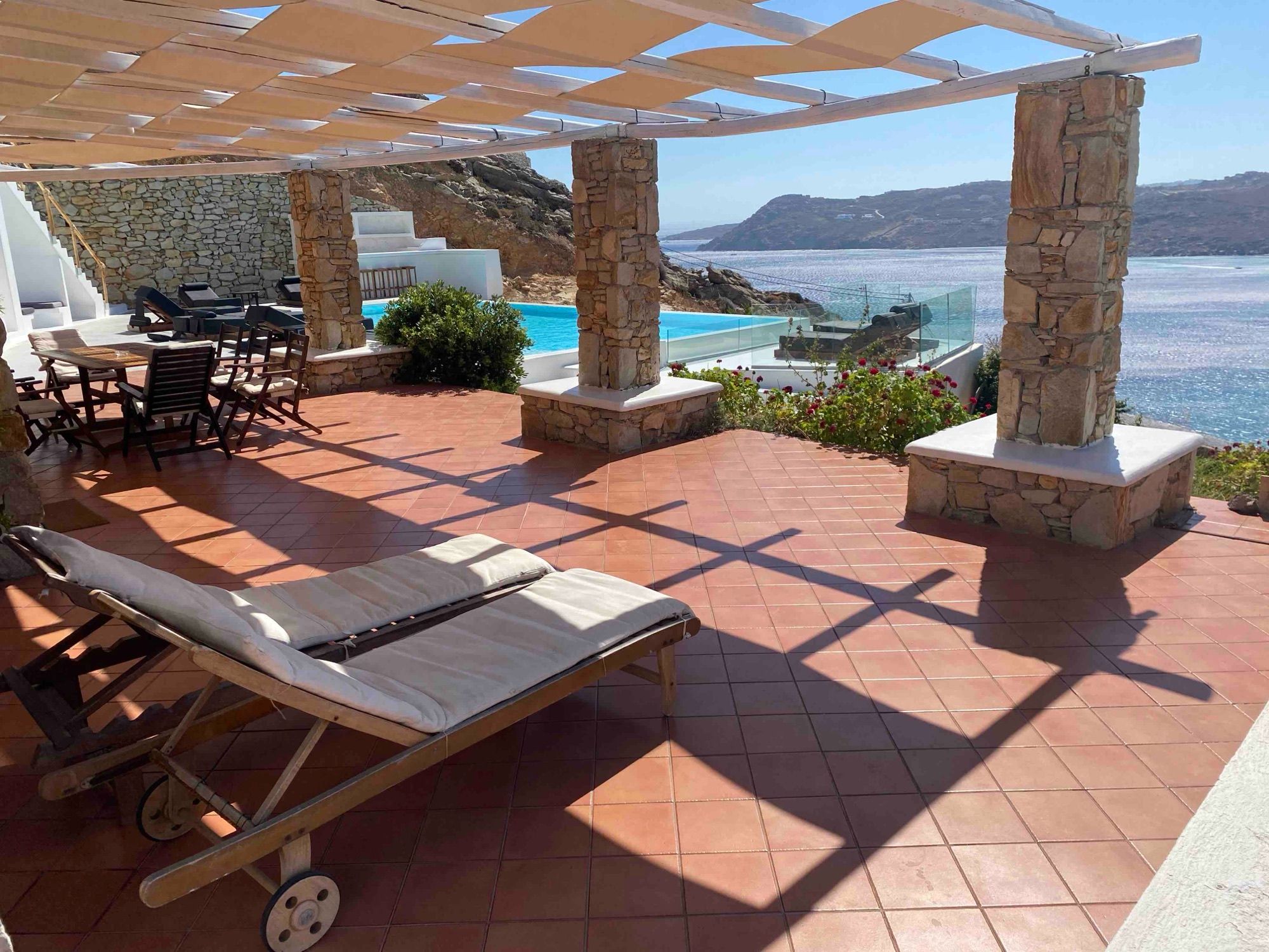 Pergola terrace with loungers and the sea beyond
